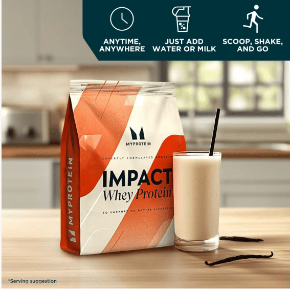 Impact whey protein with full glass near