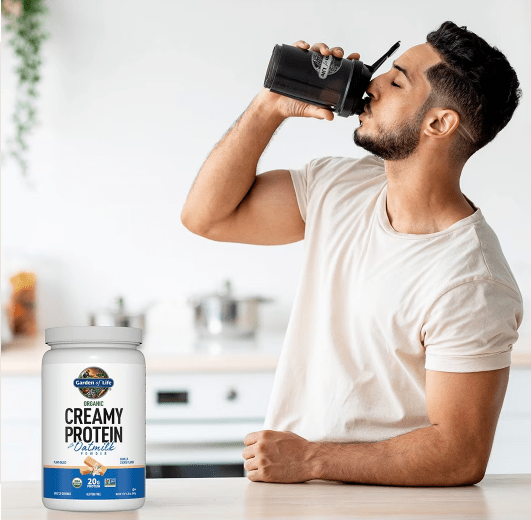 A man drinking organic creamy protein oatmilk