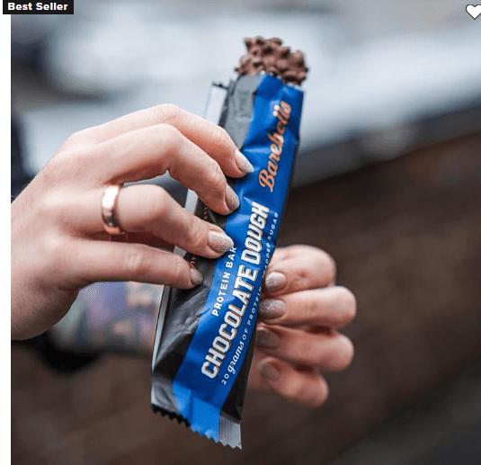 A man with layer protein bar in hand